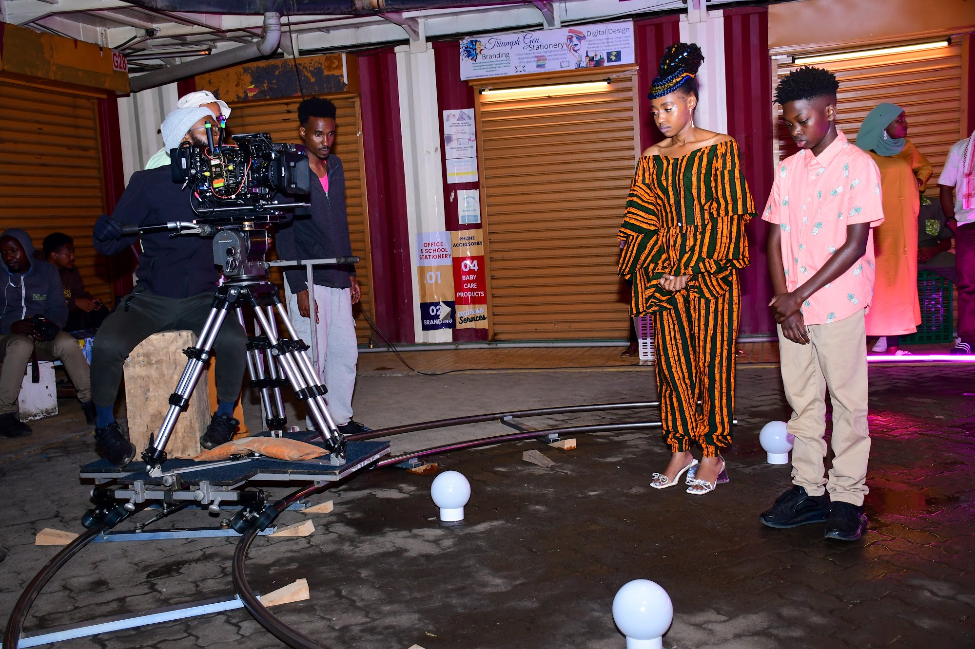 Camera dolly and lighting rig on a film set in Kenya