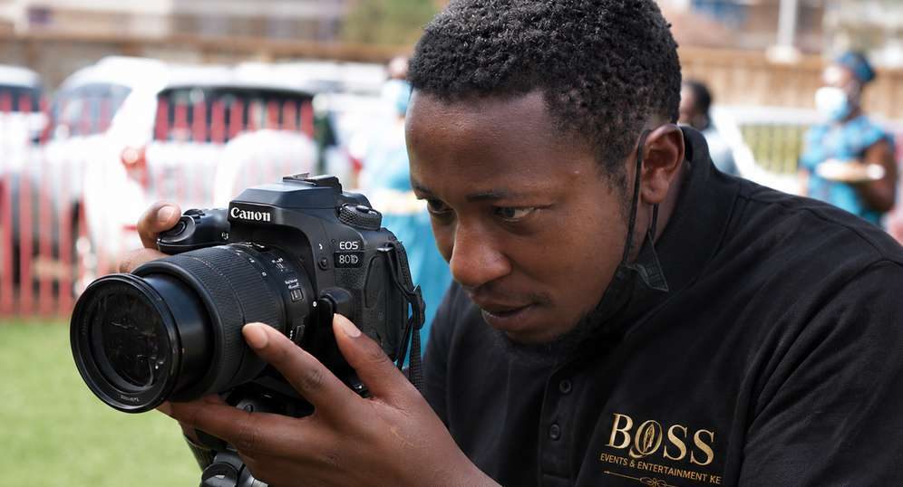 Event photographer covering a corporate event in Nairobi